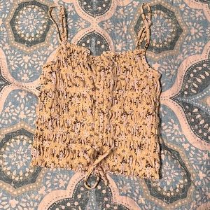 Cute spaghetti strap crop top. Adjustable front tie, and adjustable straps.
